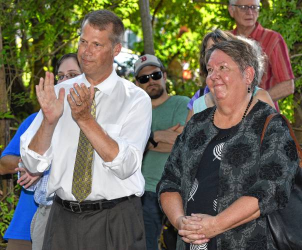 Northampton Mayor David Narkewicz and others applaud for Elizabeth Murphy, right, who is the vice president of real estate in the Springfield office of MassDevelopment, during a groundbreaking ceremony for Village Hill Cohousing, Wednesday, Sept. 5, 2018. —STAFF PHOTO/JERREY ROBERTS